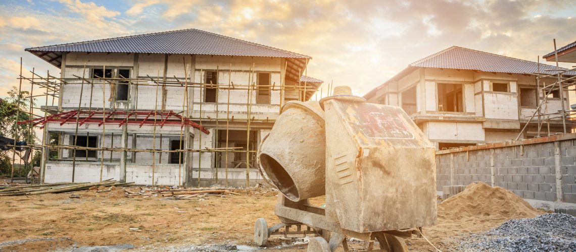 cement concrete mixer machine at new house building construction site